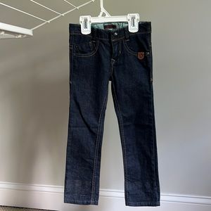 Girls size 4, like new, never worn jeans, adjustable waist.
